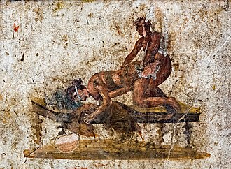 Ancient fresco depicting two figures, one applying massage techniques to the other on a massage table.
